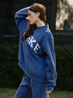 Women's Oversized Mockneck Sweatshirt with Varsity Arch Lettering